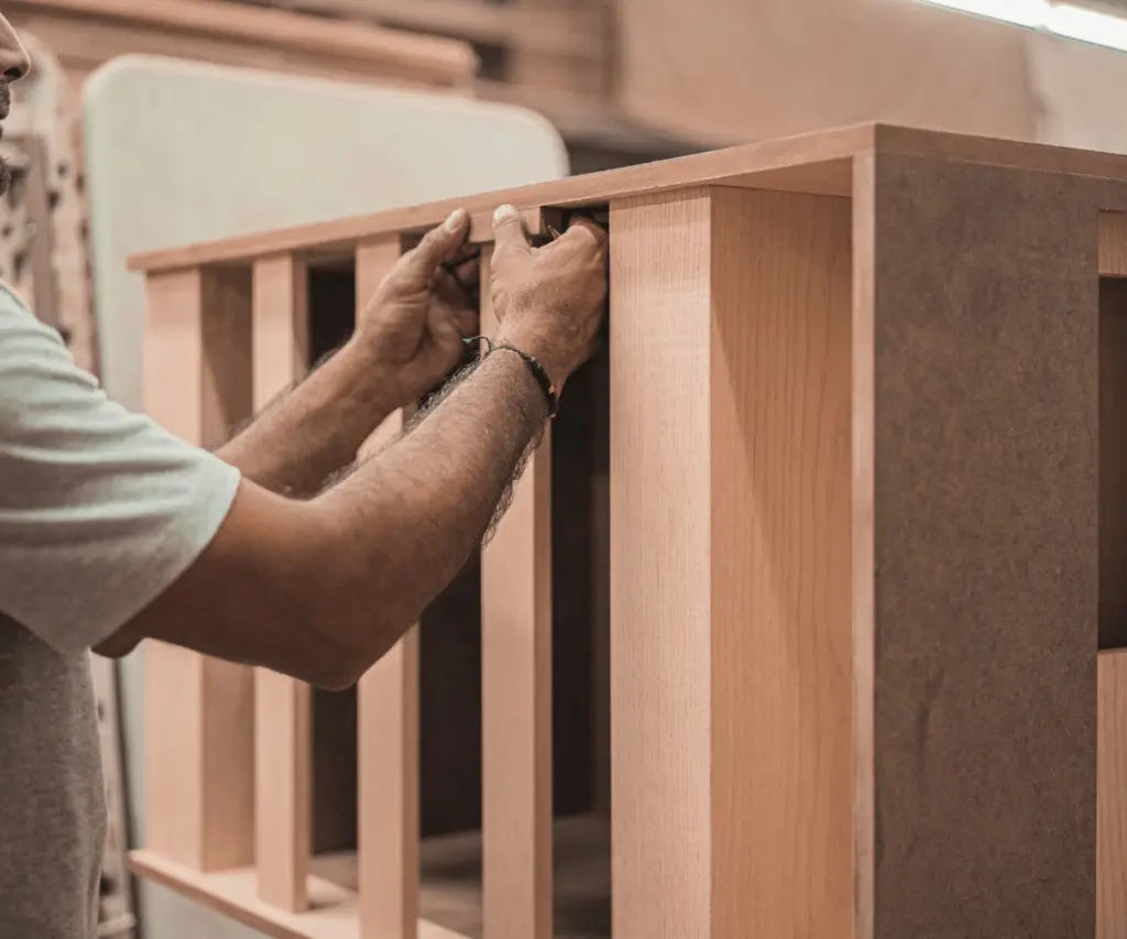 Carpenter building wooden staircase