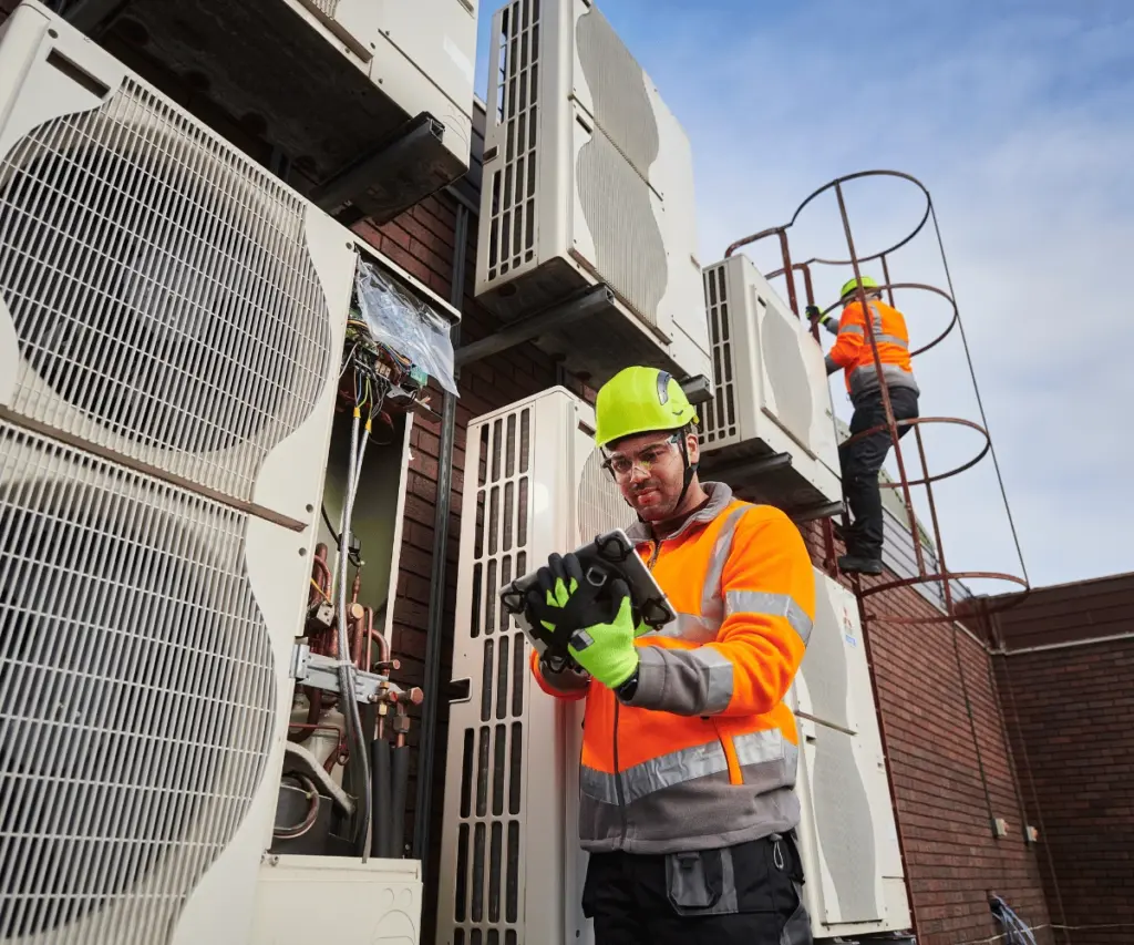 worker-maintaining-building-exterior